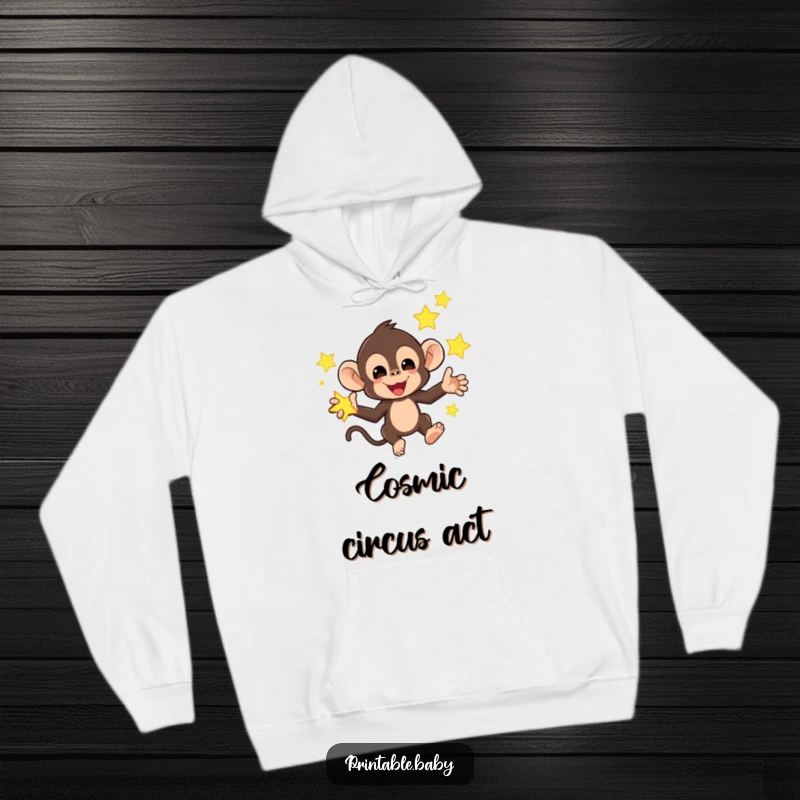 Funny hoodie with a mischievous monkey juggling bright, glowing stars, offering warm, humorous, and celestial comfort.