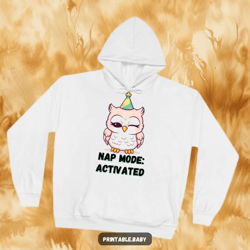 Funny sleepy baby owl wearing a party hat, one eye closed, on a cozy hoodie, great for winter humor.