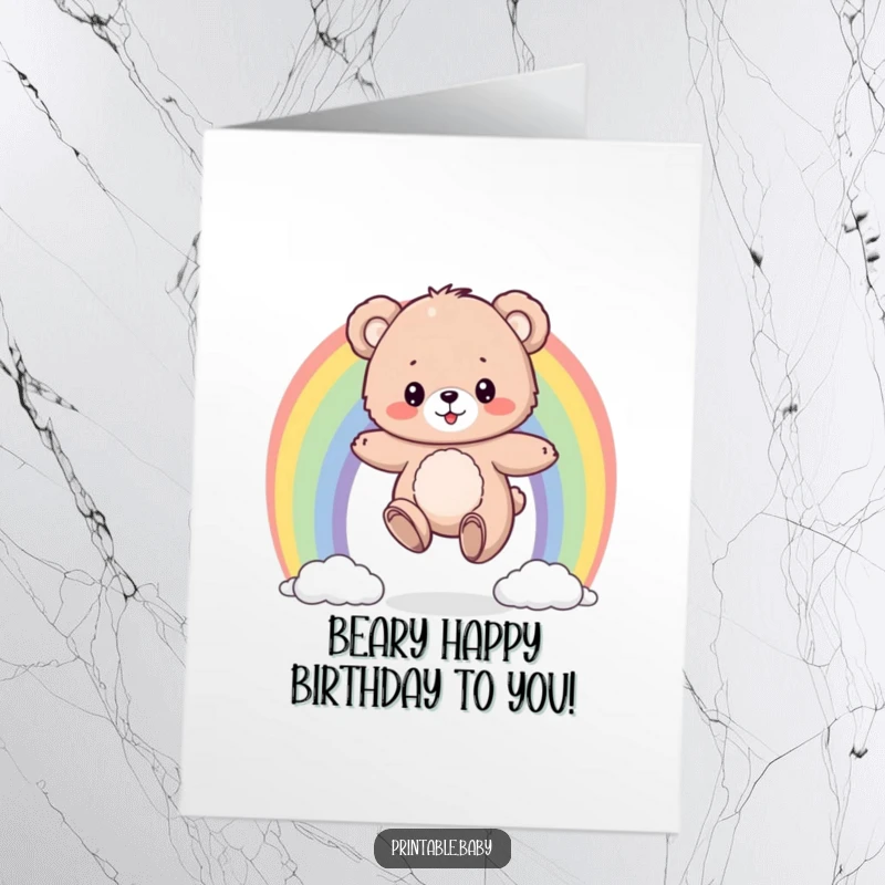 Funny Free Printable Bear Birthday Card: A fluffy bear cub bouncing on a colorful rainbow, wishing a happy birthday.