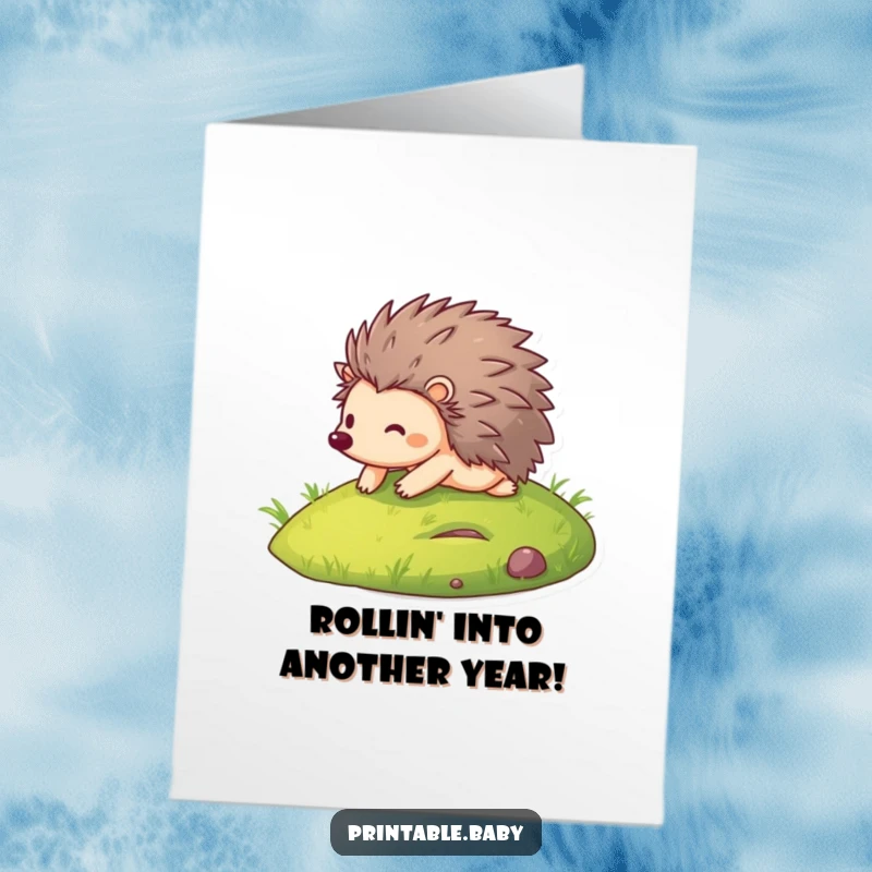 Funny Free Printable Birthday Card: Smiling hedgehog cheerfully rolling down a green grassy hill, bringing laughter.